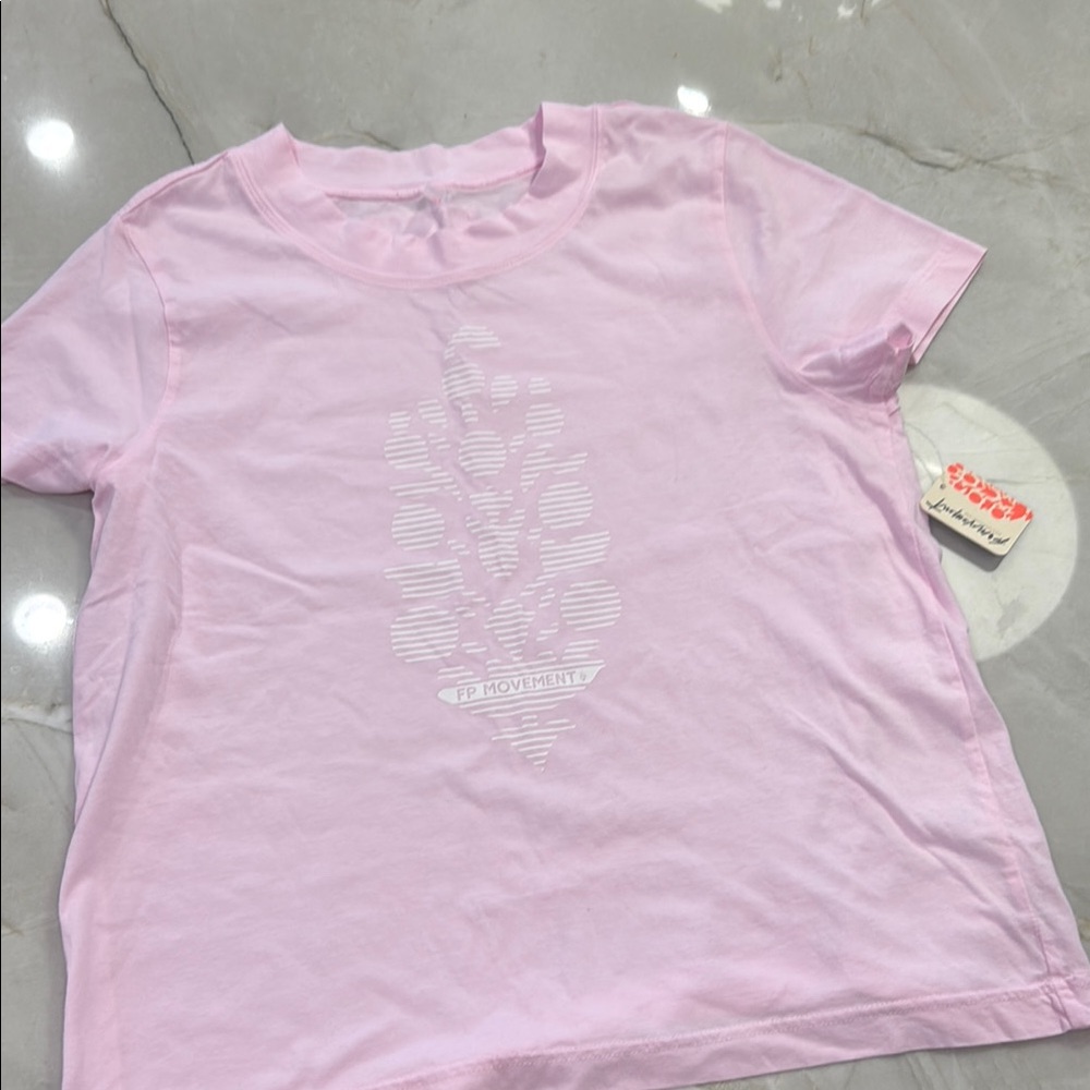 Free People Movement Women T-Shirt size medium.  Pink.  NWT